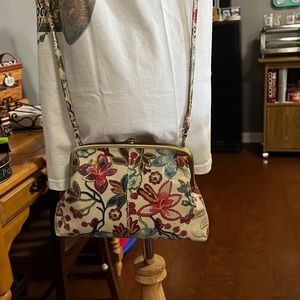 Small Hobo crossbody. Leather print with adjustable strap & snap closure.
